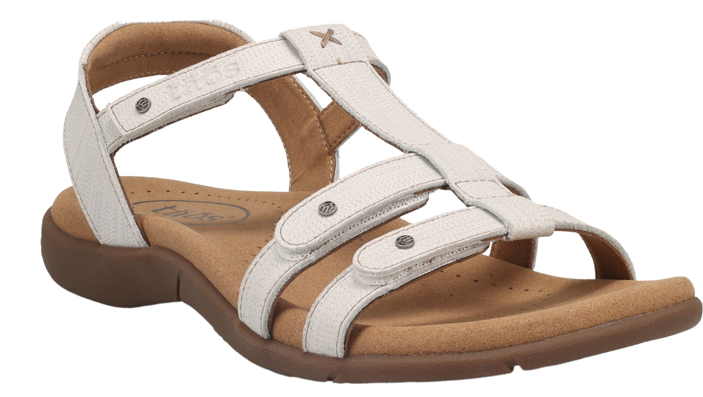 White gladiator sandal with t-strap design and three horizontal straps with silver button accents, tan sole.