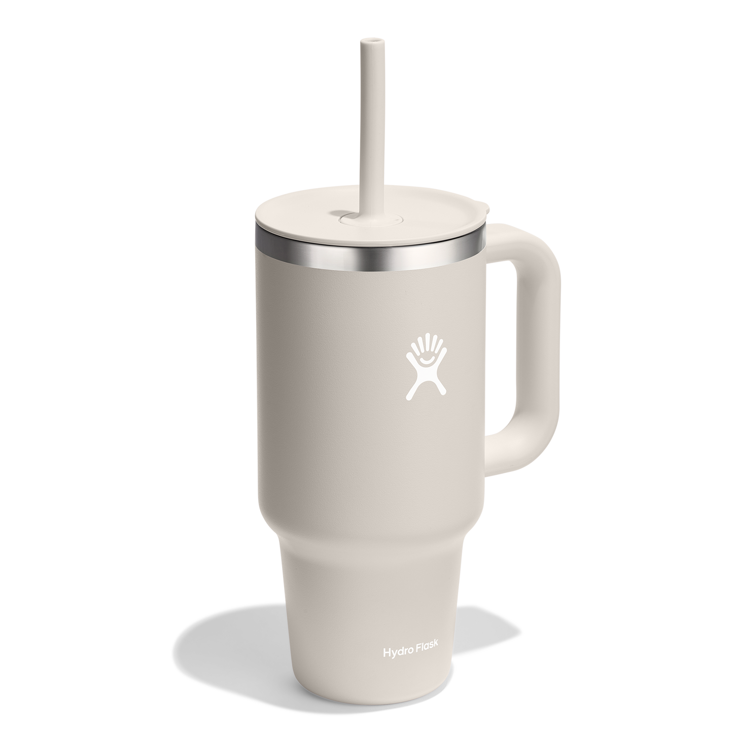White mug with handle and straw.