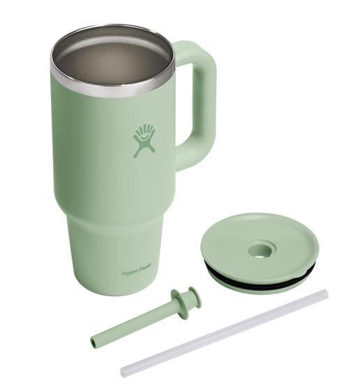 Green, stainless steel mug with handle; a lid with a black rubber ring and a straw are next to it.