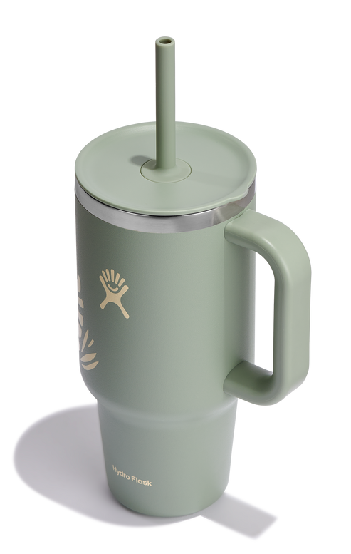 Green tumbler with handle, lid, and straw, featuring a logo.