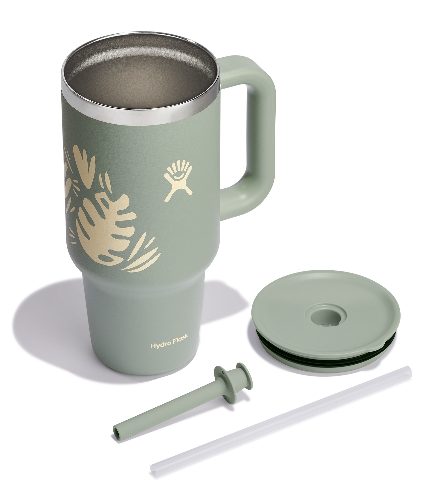 Green mug with a handle, straw, and straw lid.