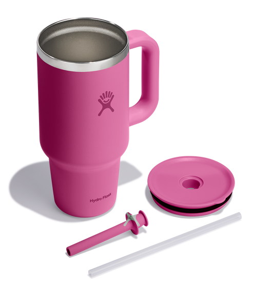 Fuchsia mug with handle, lid, and straw.