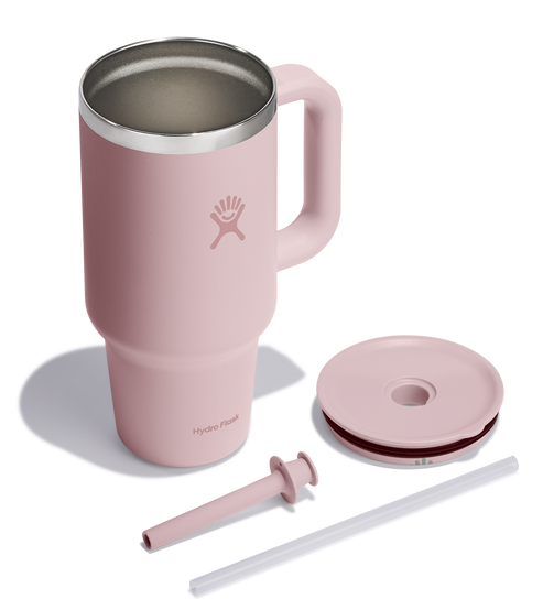 Pink stainless steel tumbler with handle, lid, straw, and cleaner.