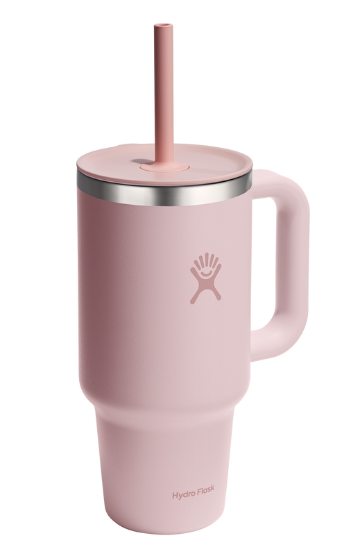 Pink insulated mug with handle and straw.