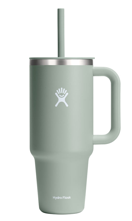 Light green insulated tumbler with handle, straw, lid, and logo.