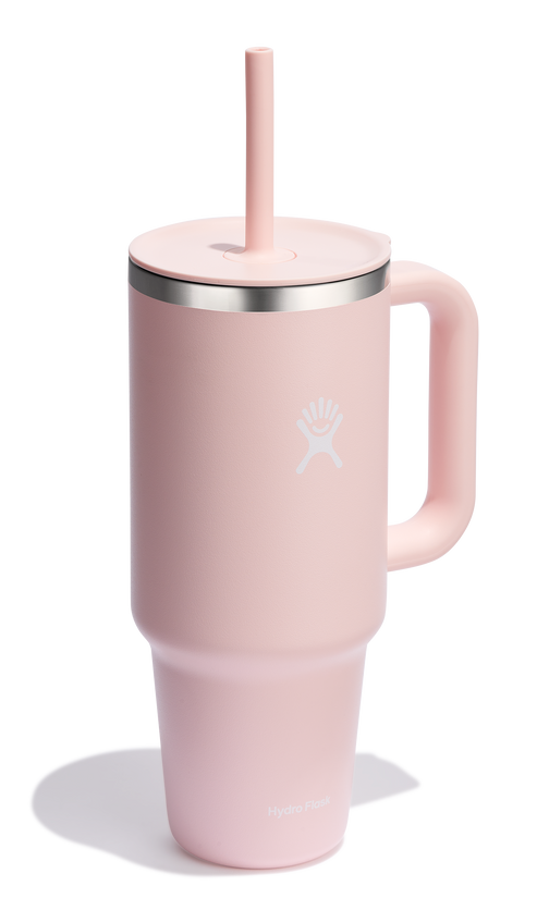 Pink stainless steel mug with handle, lid, and straw.