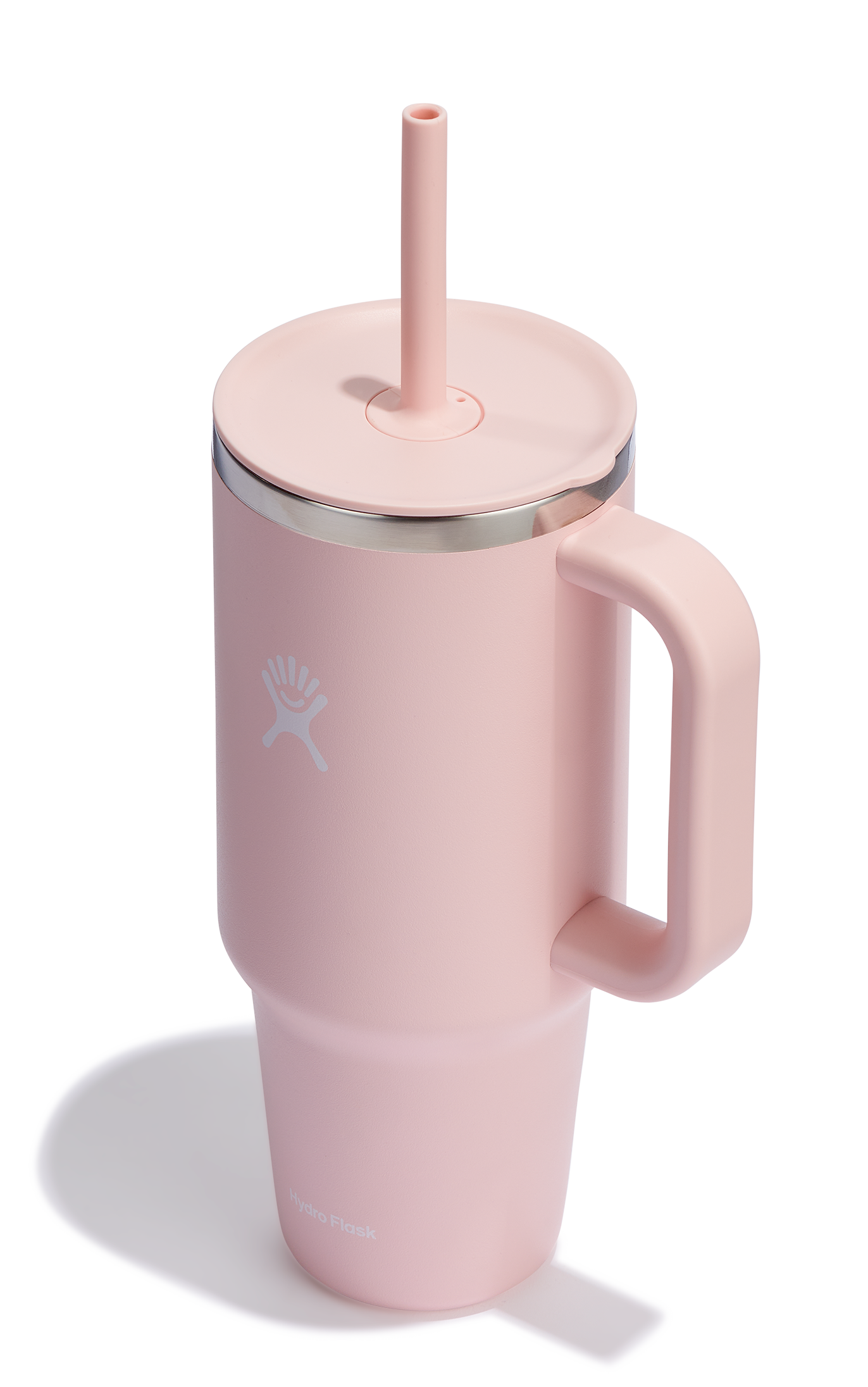 Pink insulated mug with a handle and straw lid.