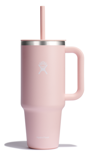 Pink mug with handle and straw.