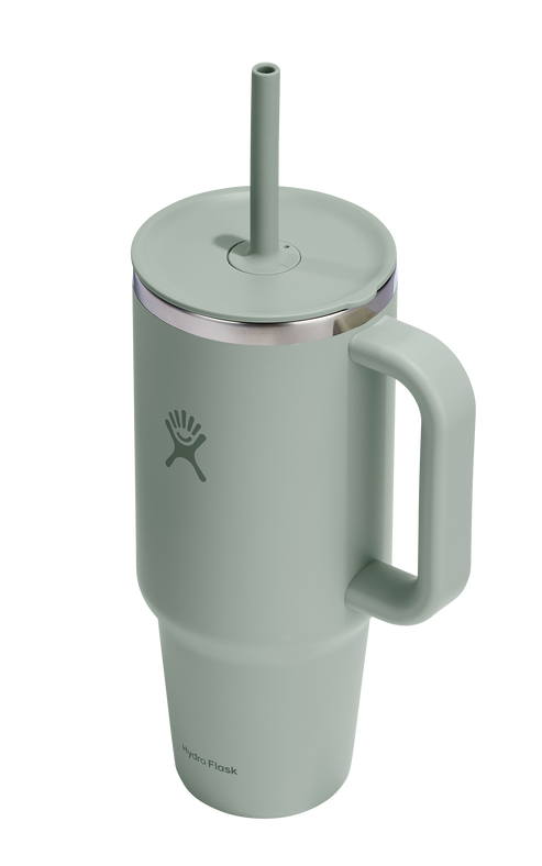 Sage-green insulated mug with handle and straw.