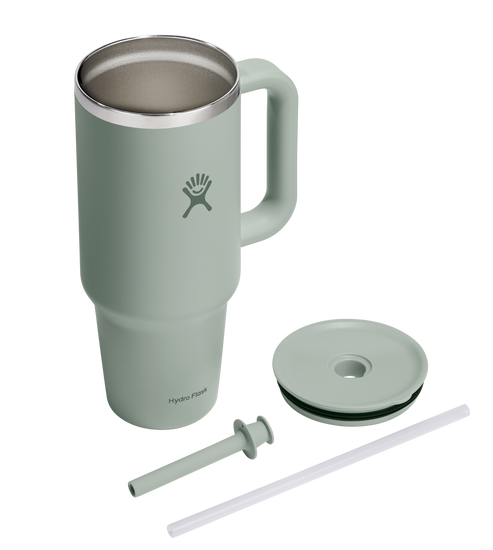 Insulated green stainless steel mug with handle, lid, and straw.