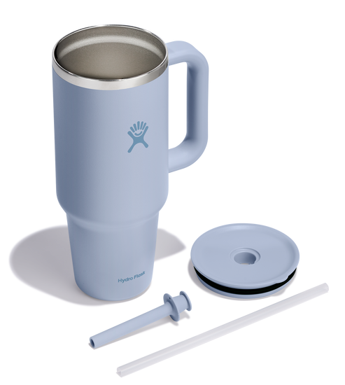 Insulated blue stainless steel mug with handle, lid, and straw.