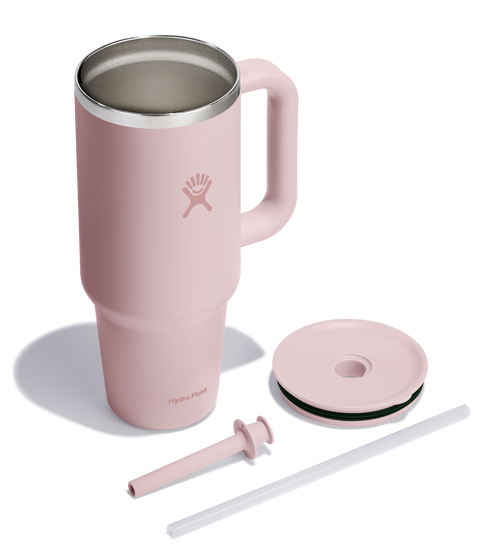 Pink handled mug with lid and straw.