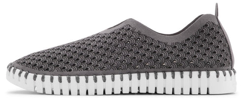 A gray shoe with a white sole, perforated top and pull tab on the heel.