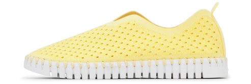 Yellow slip-on shoe with perforated upper and white sole.