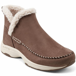 Brown ankle boot with off-white faux fur lining.
