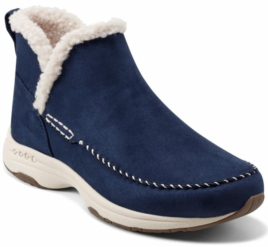 Navy blue ankle boot with off-white faux fur trim and off-white soles.