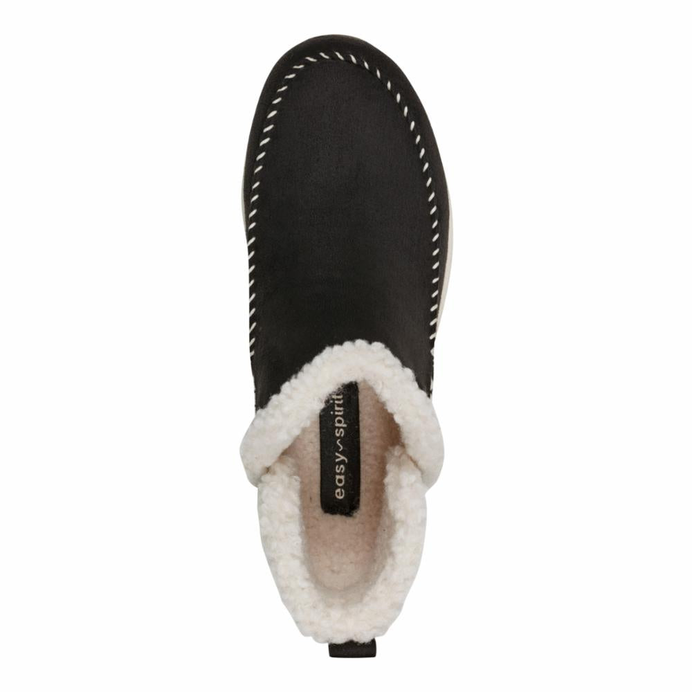 Top-down view of a black shoe with white stitching and a fluffy, white lining with easy-spirit branding.