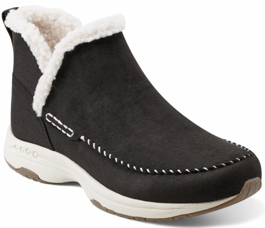Black ankle boot with white faux fur trim and white stitching detail on the side and upper.