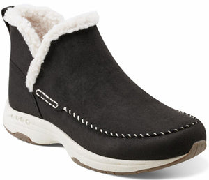 Black ankle boot with white faux fur trim and white stitching detail on the side and upper.
