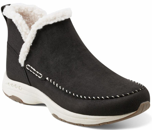 Black ankle boot with white faux fur trim and white stitching detail on the side and upper.