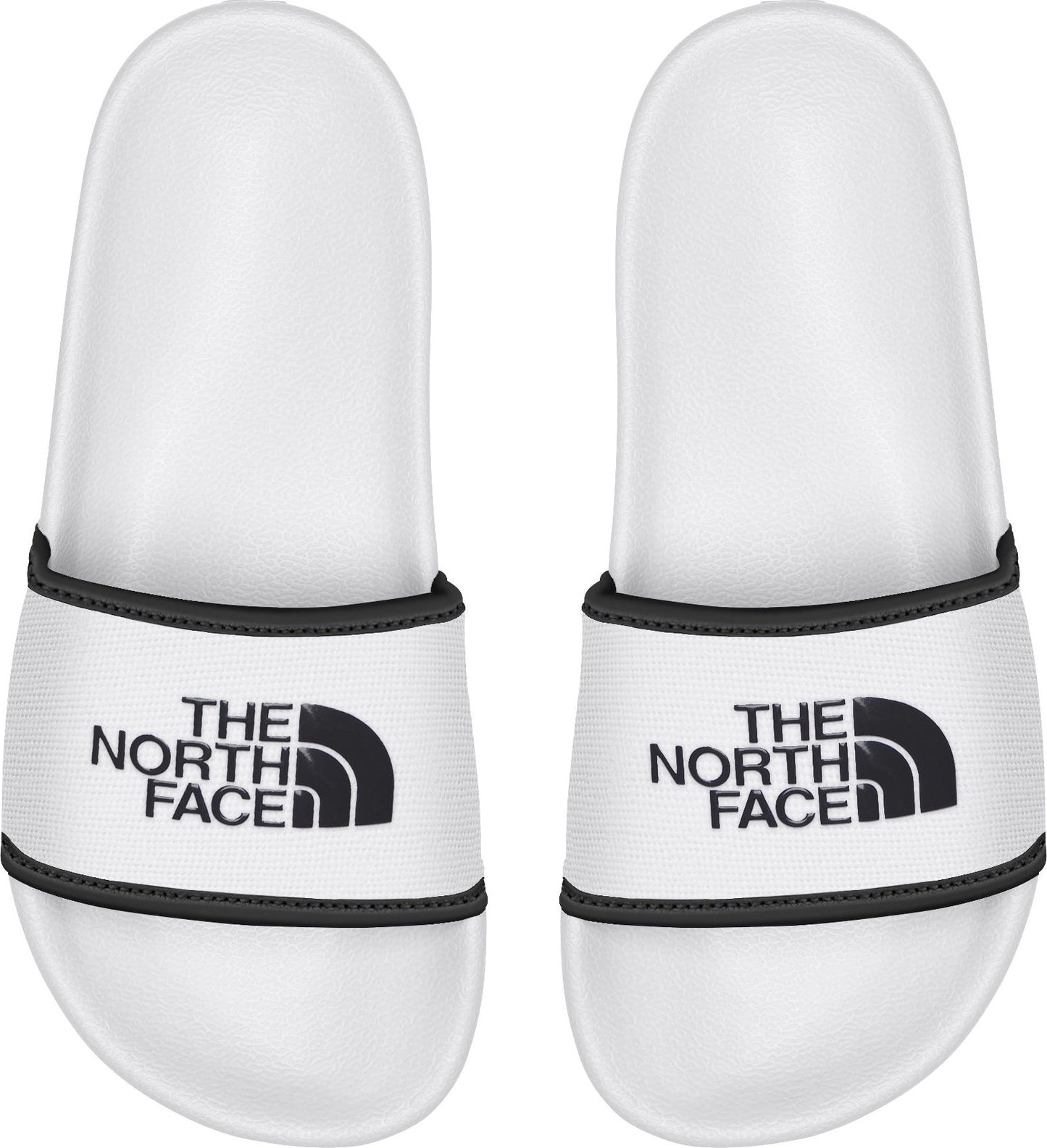 A pair of white slides with black text saying THE NORTH FACE and a black logo.