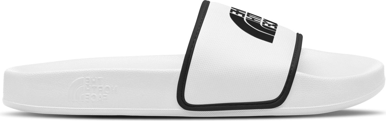 A white slide sandal with a black bordered strap and logo.