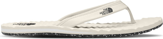 A white flip-flop with a strap that has a logo on it, and a textured sole.