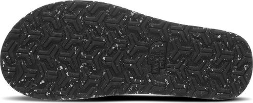 Bottom of a sandal with a deep geometric tread.