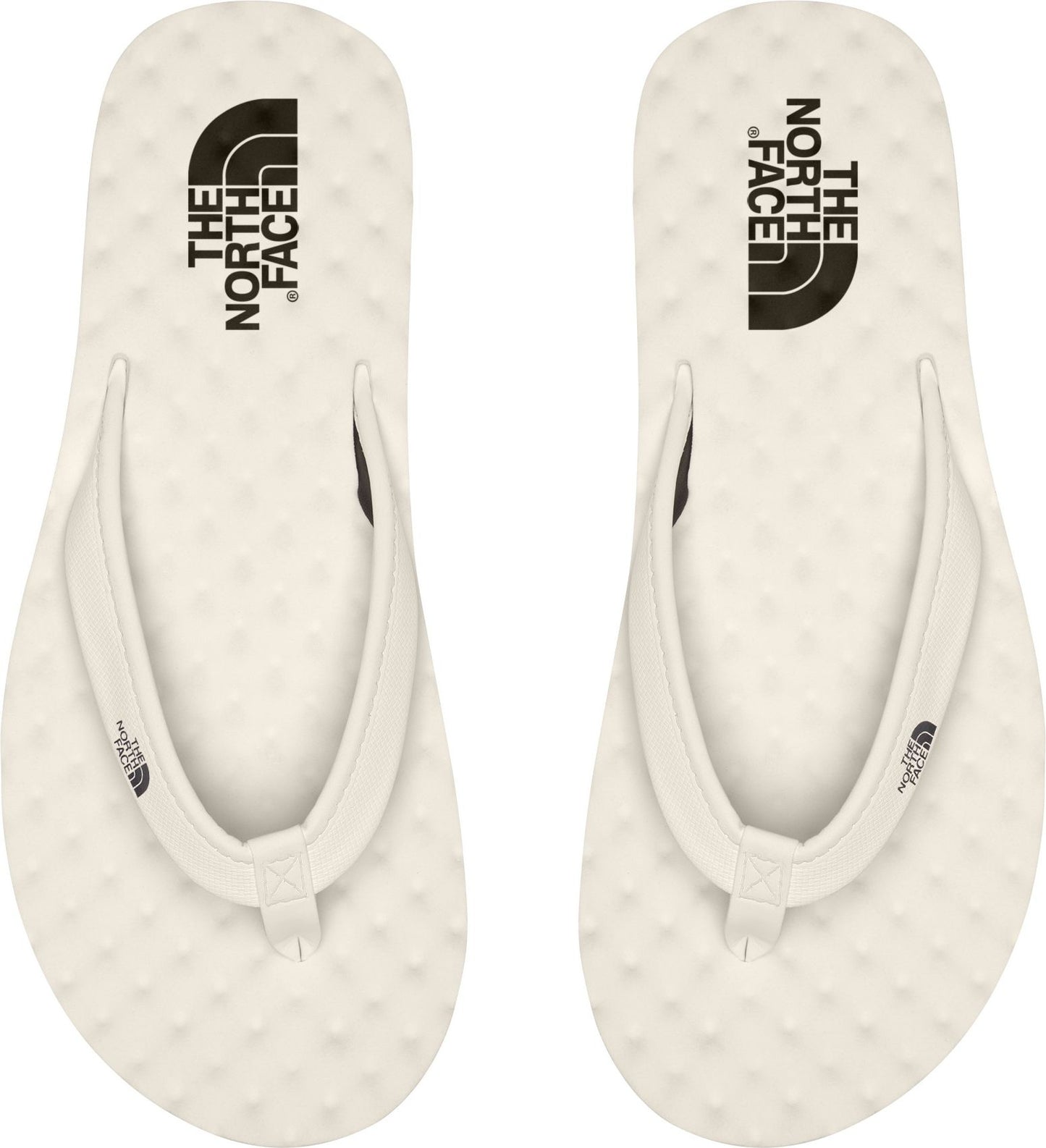 Two off-white flip-flops with the text "THE NORTH FACE" printed on each.