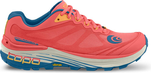 A salmon-colored shoe with a blue and yellow sole, blue interior, and yellow accents around the laces.