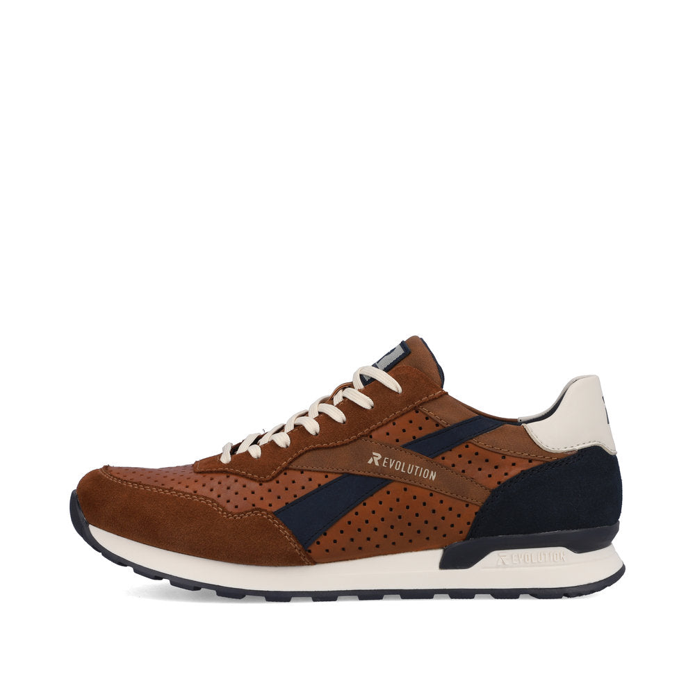 A brown sneaker with white laces and accents, featuring navy blue stripes and perforation details.