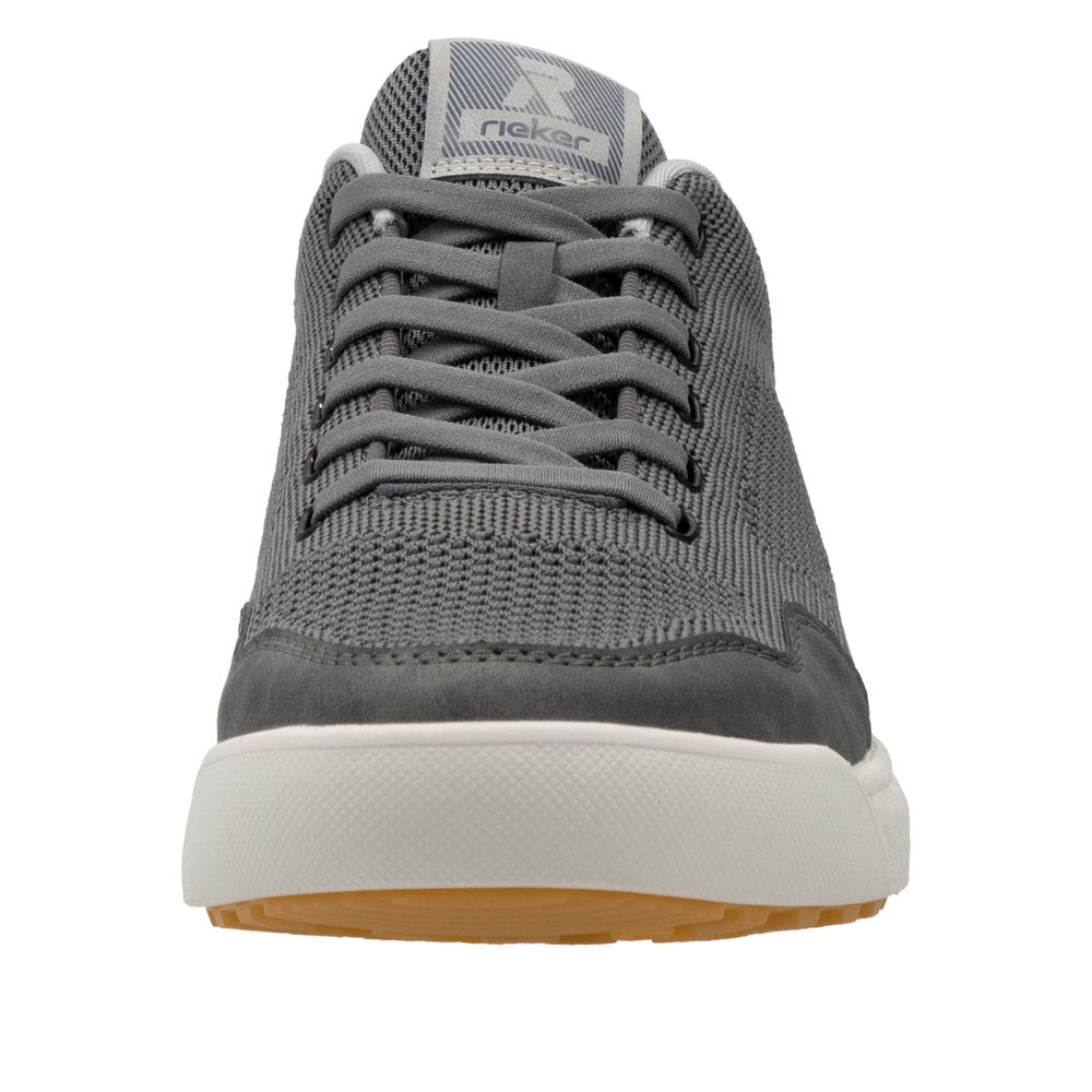 Gray sneaker with white sole and laces, visible 'R' logo on tongue.