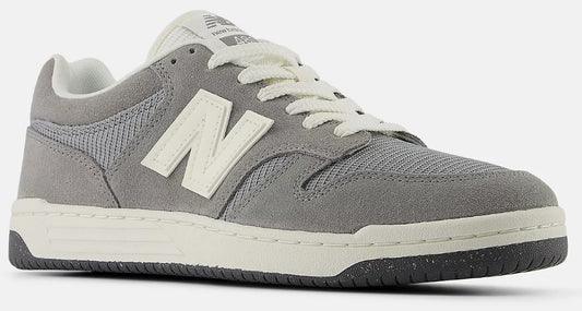 Grey low-top sneaker with white laces and "N" logo.