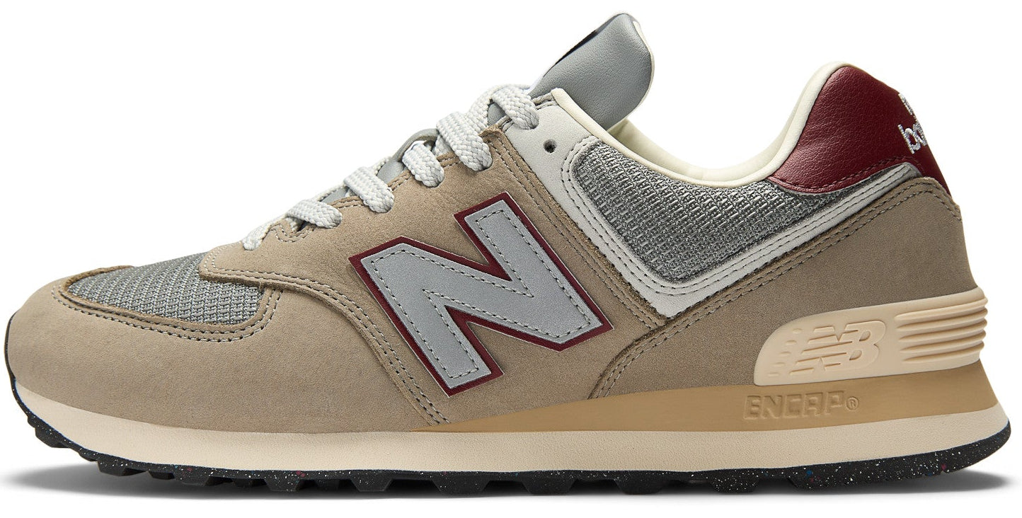 Beige athletic shoe with large gray 'N' logo, gray mesh, beige suede, and maroon heel detail.