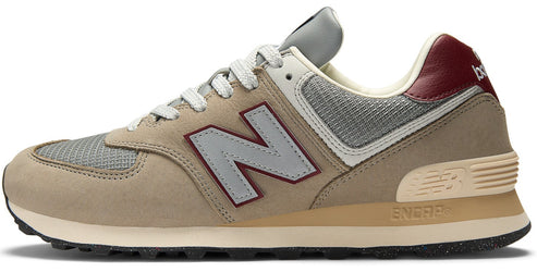 Beige athletic shoe with large gray 'N' logo, gray mesh, beige suede, and maroon heel detail.