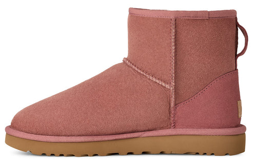 Rose pink suede ankle boot with rubber sole and pull tab.