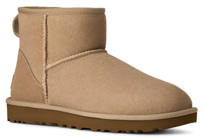 Tan ankle-high boot with a pull tab.