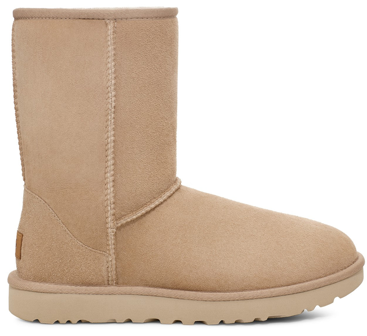 Tan suede boot with rounded toe and flat sole.