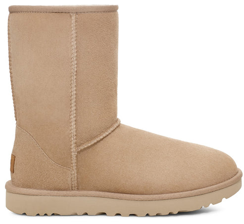 Tan suede boot with rounded toe and flat sole.