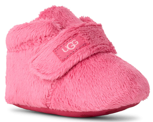 Pink furry baby bootie with a hook and loop strap featuring a visible logo.