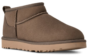 Ankle-high brown suede boot with a thick, light brown sole.