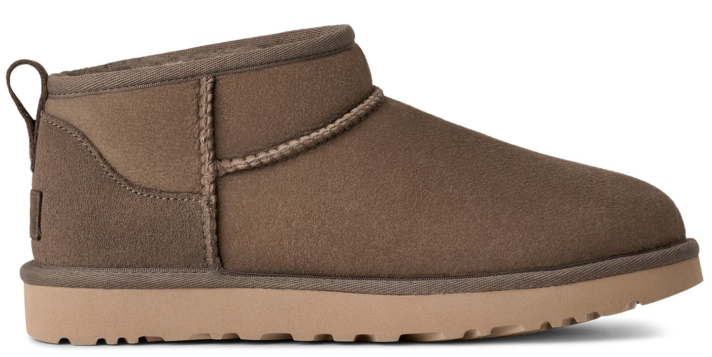 Short light brown suede boot with tan sole and pull tab.