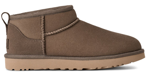 Short light brown suede boot with tan sole and pull tab.