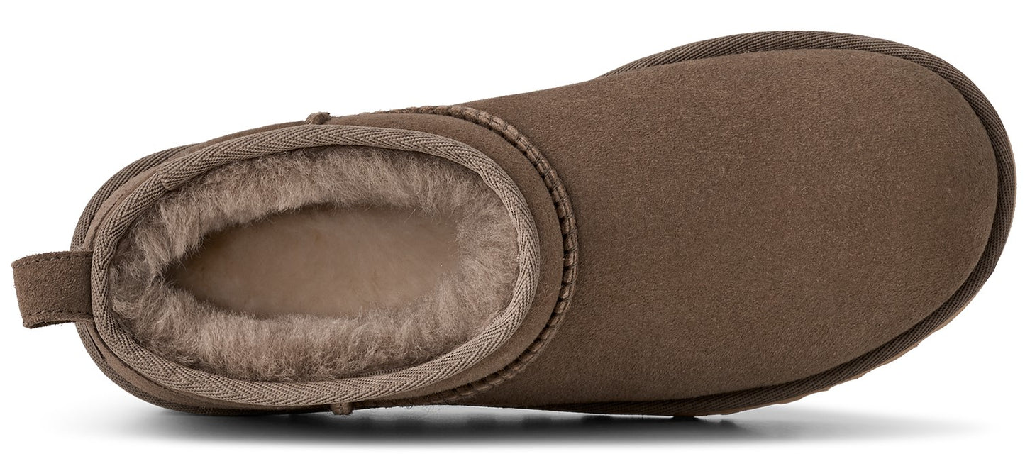A close-up of a brown slipper showing fluffy interior lining.