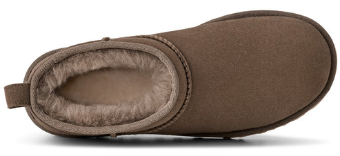 A close-up of a brown slipper showing fluffy interior lining.