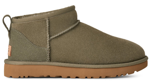 Olive green suede ankle boot with light brown sole and pull tab.