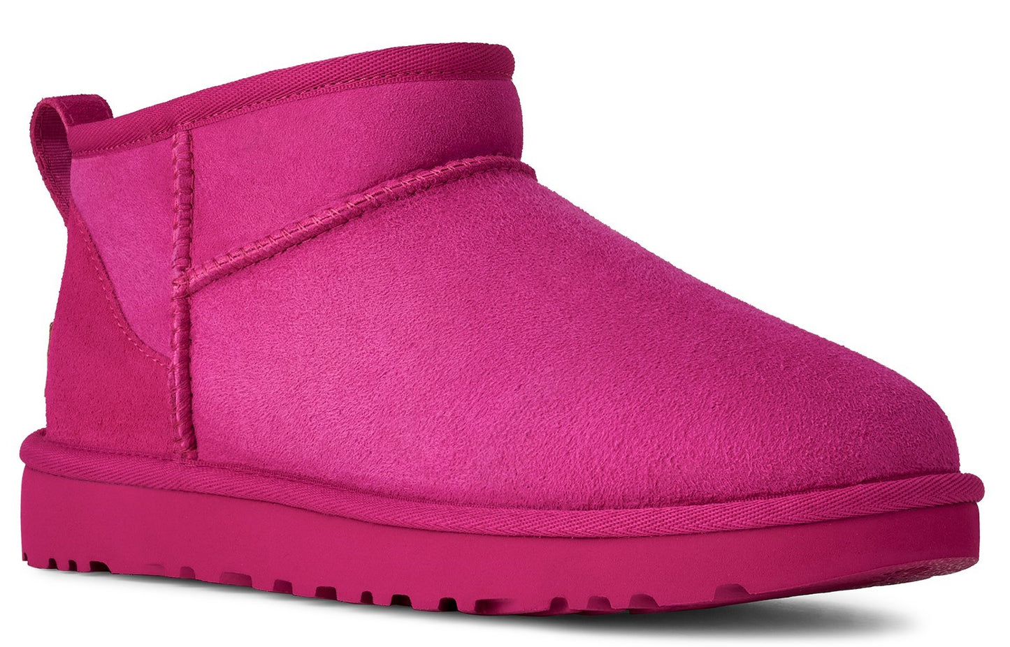 Hot pink ankle boot with a round toe and a loop at the back of the ankle.