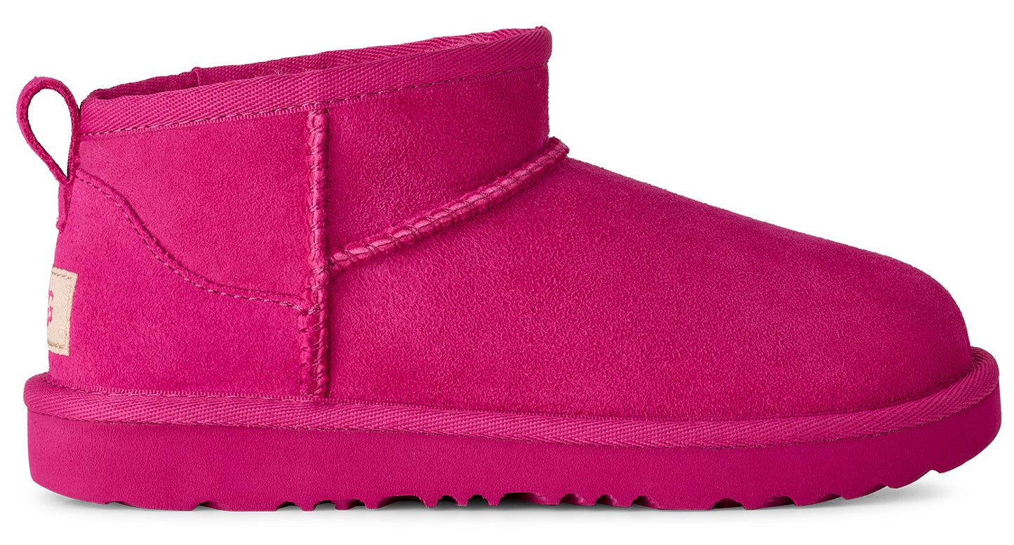Bright pink suede UGG ankle boot with a looped pull tab.