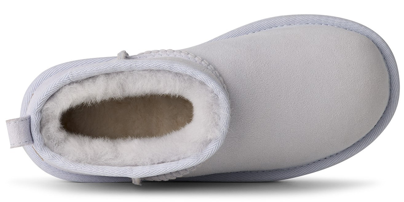 White ankle boot with fuzzy interior.