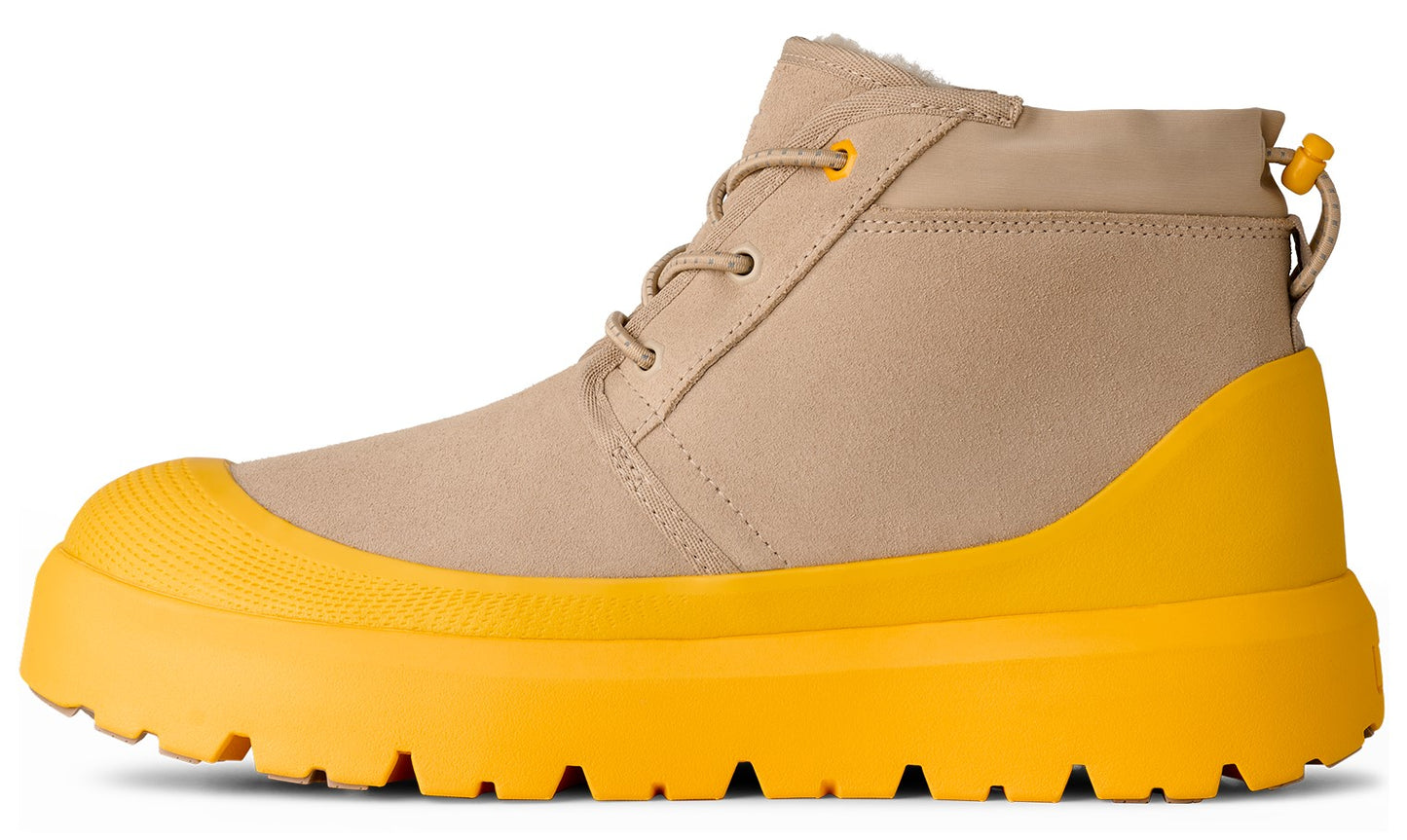 Tan chukka boot with bright yellow sole.
